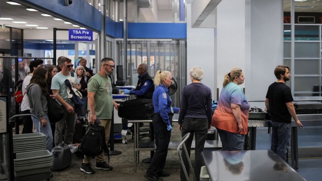 Travelers pass through a Transportation Security Administration (TSA) security screening at Hollywood Burbank Airport during the first day of a partial U.S. government shutdown in Burbank, California, U.S., October 1, 2025. (Reuters/Daniel Cole)