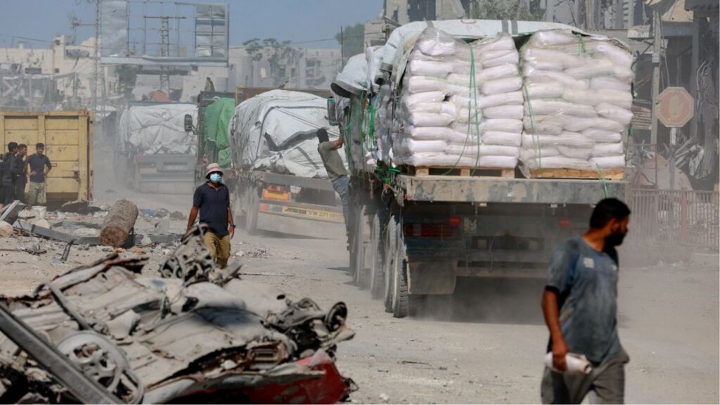 Trucks carry aid for Palestinians, amid a ceasefire between Israel and Hamas in Gaza, in Khan Younis, in the southern Gaza Strip, October 14, 2025. (Reuters/Ramadan Abed)