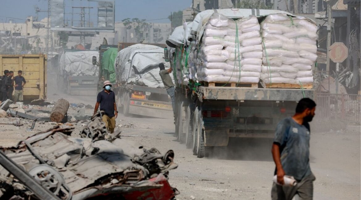 Trucks carry aid for Palestinians, amid a ceasefire between Israel and Hamas in Gaza, in Khan Younis, in the southern Gaza Strip, October 14, 2025. (Reuters/Ramadan Abed)