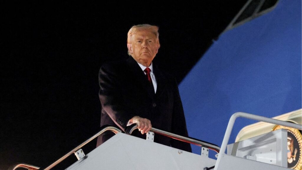 U.S. President Donald Trump looks on while boarding Air Force One as he departs for Asia, at Joint Base Andrews, Maryland, U.S., October 24, 2025. (Reuters/Evelyn Hockstein)