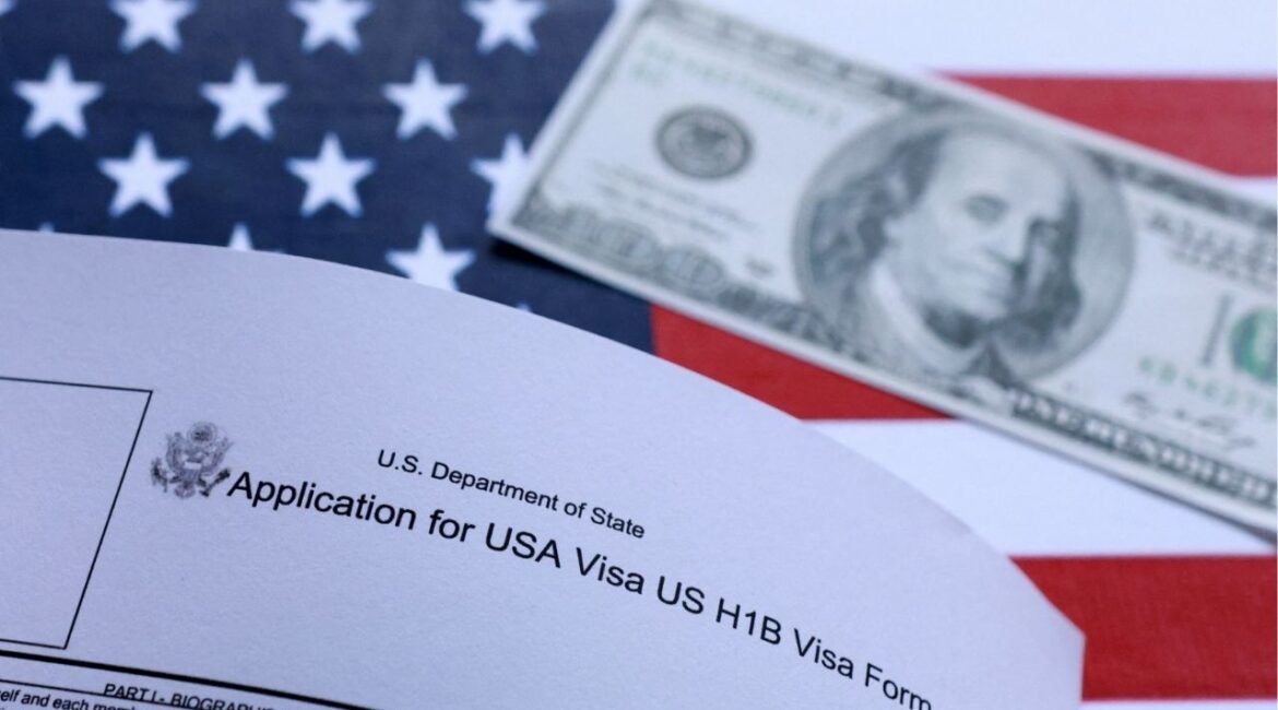 U.S. flag, mock passport, 100 dollar banknote and H-1B visa application form are seen in this illustration taken September 26, 2025. (Reuters/Dado Ruvic/Illustration)