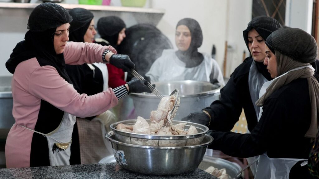 Women from Southern Lebanon prepare meals as they work in a community kitchen in Tyre, Lebanon, September 23, 2025. (Reuters/Aziz Taher)