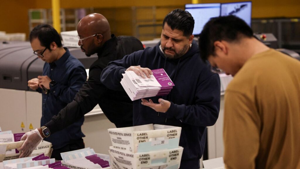 Image of election workers handling ballots in City of Industry, California