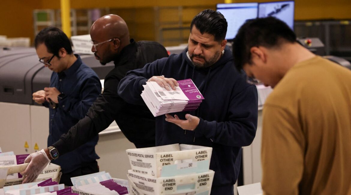 Image of election workers handling ballots in City of Industry, California