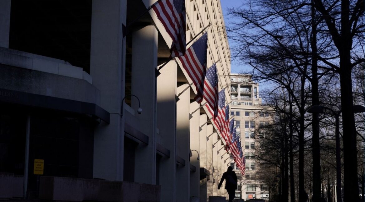 A pedestrian walks past the headquarters of the Federal Bureau of Investigation (FBI) in Washington, U.S., March 22, 2019. (Reuters/Joshua Roberts)
