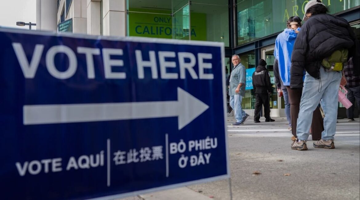 A person exits a vote center the California Museum in Sacramento on Nov. 4, 2025. (CalMatters/Jungho Kim)