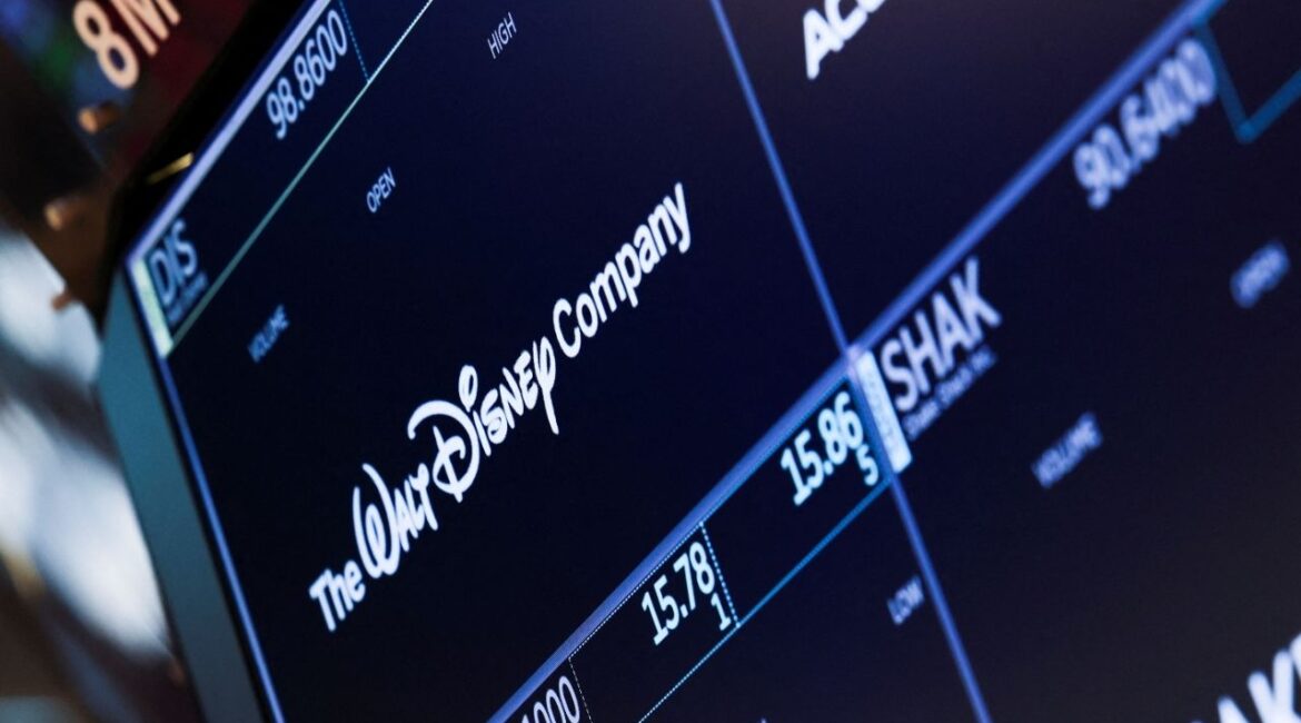 A screen shows the logo and a ticker symbol for The Walt Disney Company on the floor of the New York Stock Exchange (NYSE) in New York, U.S., March 21, 2025. (Reuters/Jeenah Moon)