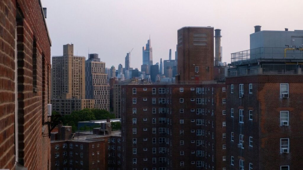 A view of the Manhattan skyline in New York, June 4, 2025. The poor state of many public housing buildings is one of many housing issues beyond freezing the rent that Mayor-elect Zohran Mamdani will be facing as soon as he takes office in January. (Dakota Santiago/The New York Times)