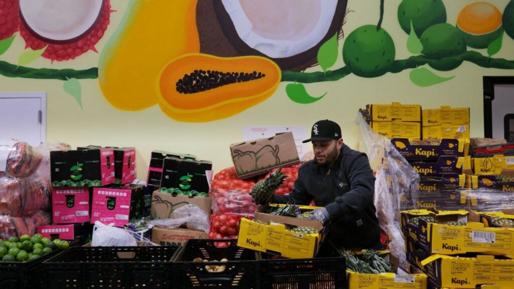 A worker sorts fresh fruit and vegetables at La Colaborativa's food pantry, as food aid benefits, in Chelsea, Massachusetts, U.S., October 29, 2025. (Reuters File)