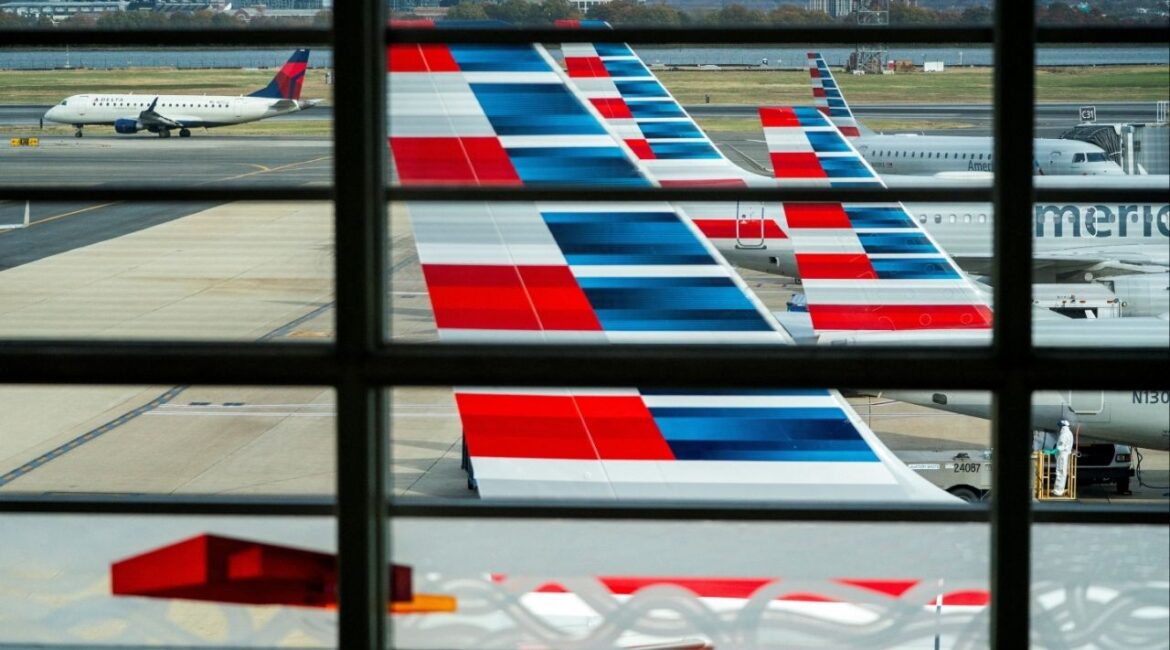American Airlines flights stage at Ronald Reagan Washington National Airport as the Trump administration warns of impending cuts to commercial airline operations more than a month into the continuing U.S. government shutdown in Arlington, Virginia, U.S., November 7, 2025. (Reuters/Nathan Howard)