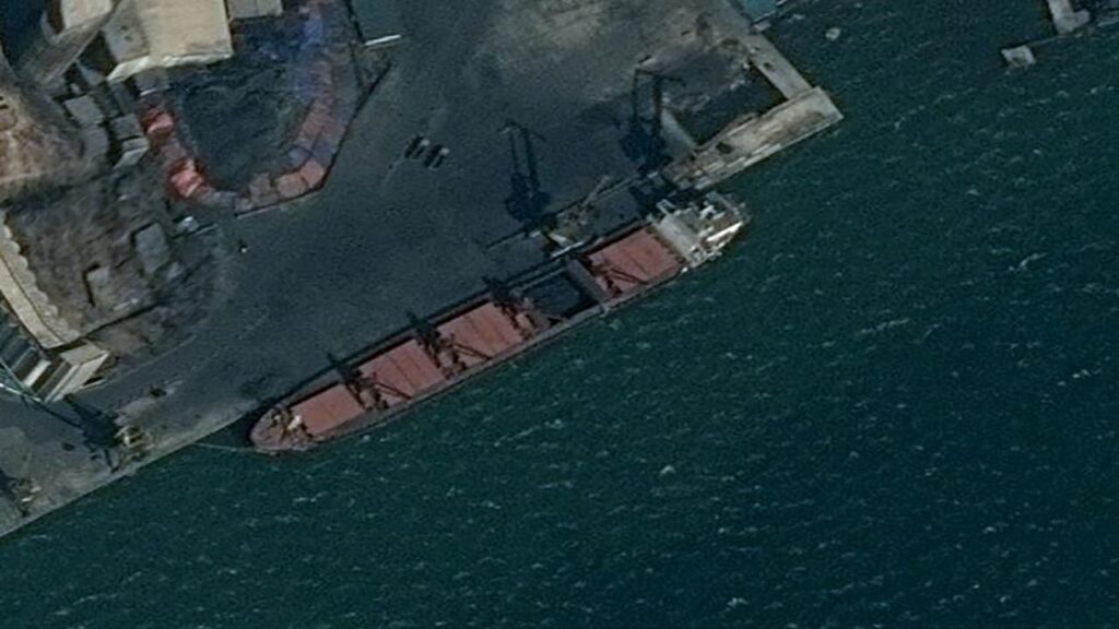 An undated surveillance image provided by the U.S. Department of Justice shows what is described as a North Korean vessel being loaded with coal in Nampo, North Korea. (Reuters File)