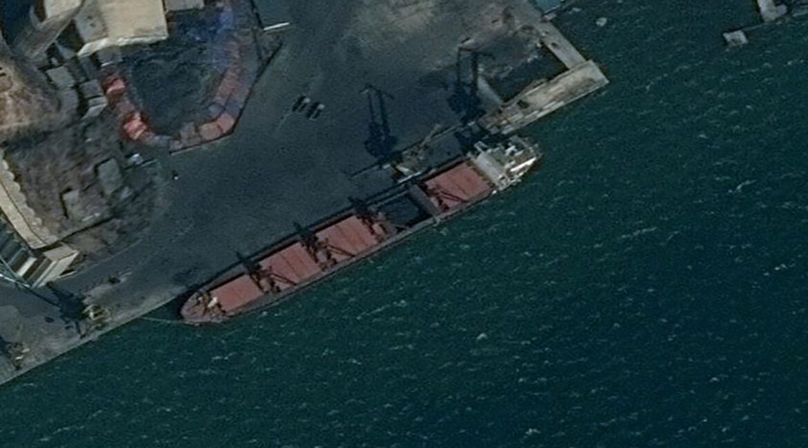 An undated surveillance image provided by the U.S. Department of Justice shows what is described as a North Korean vessel being loaded with coal in Nampo, North Korea. (Reuters File)