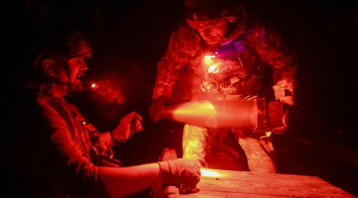 Artillerymen of the 152nd Separate Jaeger Brigade unload shells for an M114 self-propelled howitzer, amid Russia's attack on Ukraine, near the frontline town of Pokrovsk in Donetsk region, Ukraine October 14, 2025. (Reuters/Anatolii Stepanov)