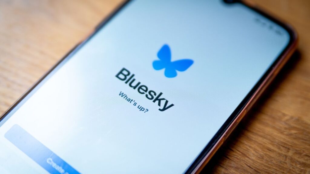 Asset id: 2548724903 Barcelona, Spain - 21 November 2024: The logo of the social media app Bluesky is seen on the screen of a mobile phone. Bluesky is a competitor of Twitter and Mastodon