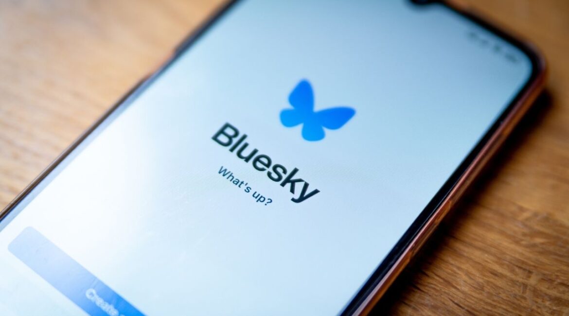 Asset id: 2548724903 Barcelona, Spain - 21 November 2024: The logo of the social media app Bluesky is seen on the screen of a mobile phone. Bluesky is a competitor of Twitter and Mastodon