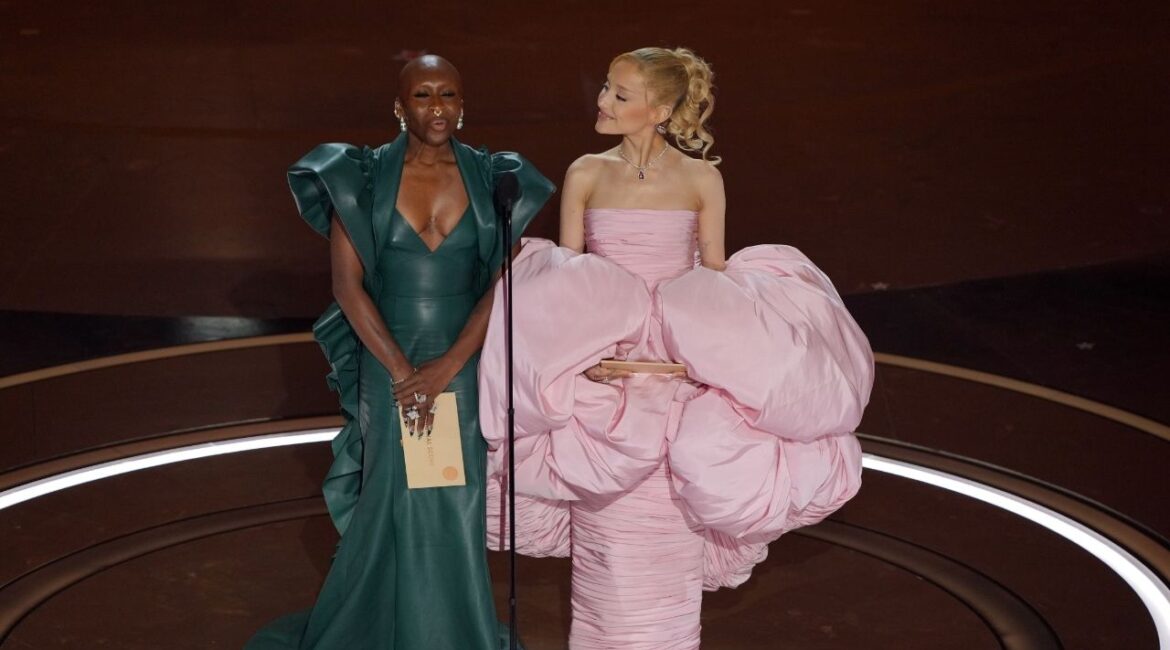 Cynthia Erivo, left, and Ariana Grande at the Oscars in Los ANgeles on March 10, 2024. One could argue that the press tour for “Wocked” and “Wicked: For Good” began in March 2024, more than seven months before the first film’s release, when Grande and Erivo presented best original score at the Oscars. (Amir Hamja/The New York Times)