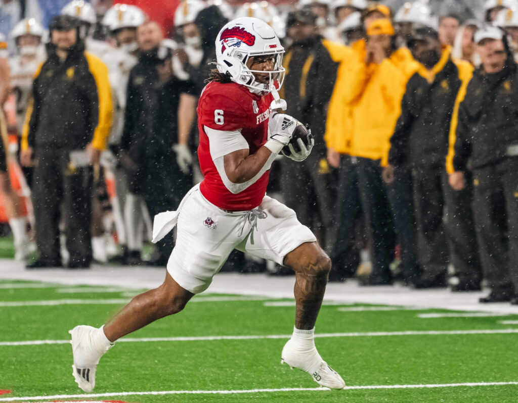 Bryson Donelson runs for a first-quarter touchdown against Wyoming