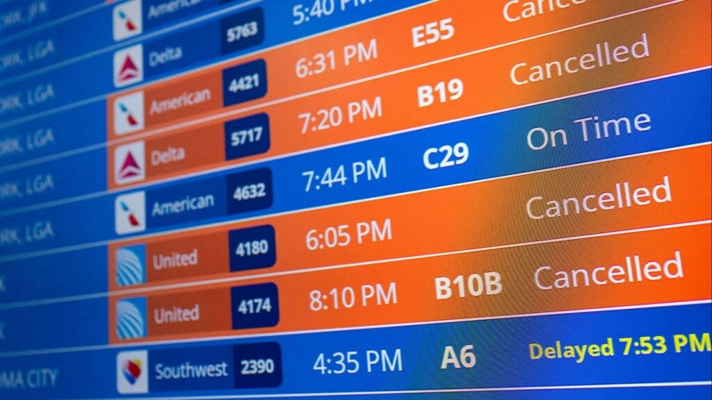 Flight timings and cancellations are displayed on the departures board, a month into the ongoing U.S. government shutdown, at Ronald Reagan Washington National Airport in Arlington, Virginia, U.S., November 9, 2025. (Reuters/Annabelle Gordon)