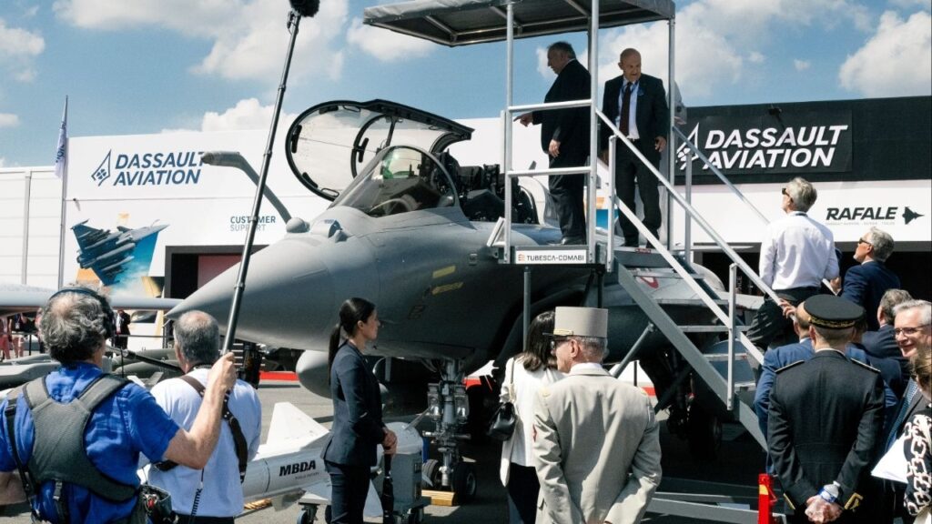François Bayrou, top left, then the prime minister of France, inspects a Rafale fighter aircraft during the Paris International Air Show at Paris-LeBourget Airport outside of Paris, June 16, 2025. France pledged on Monday, Nov. 17, to sell up to 100 Rafale fighter jets to Ukraine in a show of European support as the Trump administration has limited its military backing for the country. (Dmitry Kostyukov/The New York Times)