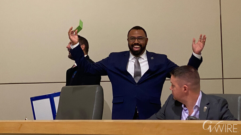 Fresno City Councilmember Nelson Esparza draws a green card, allowing him to participate in the Tower District Specific Plan discussion he would otherwise be conflicted out of
