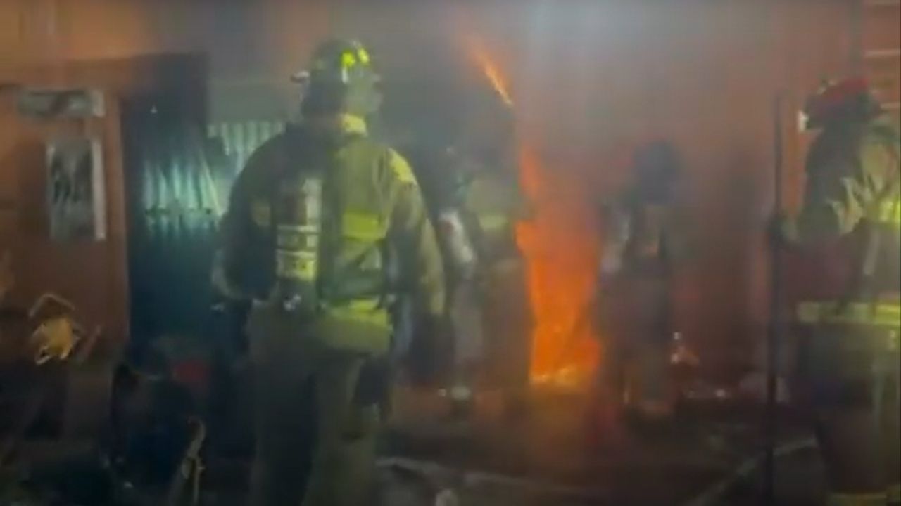 Fresno firefighters rescued an unconscious man from a heavily secured vacant building in Chinatown late Sunday night after a structure fire, and he has since been released from the hospital on Sunday, Nov. 9. (FD)