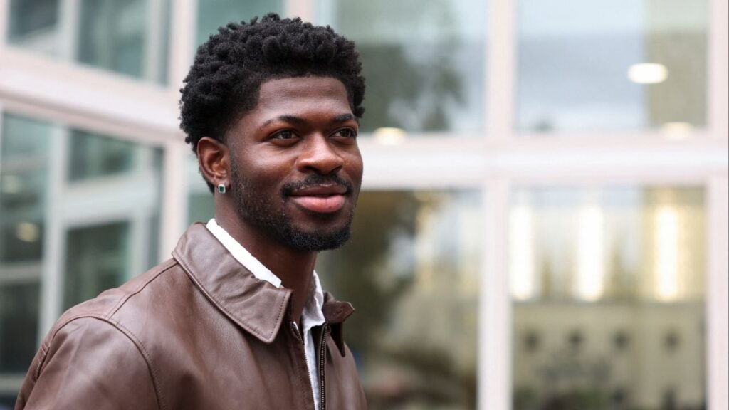 Grammy-winning musician Lil Nas X, whose legal name is Montero Hill, looks on outside a court, as he leaves following his preliminary hearing on four felony charges for allegedly assaulting and resisting police officers responding to an incident in August when police approached him while he was reportedly walking nearly naked on the streets of Los Angeles, in Van Nuys, California, U.S., November 17, 2025. (Reuters/Alison Dinner)