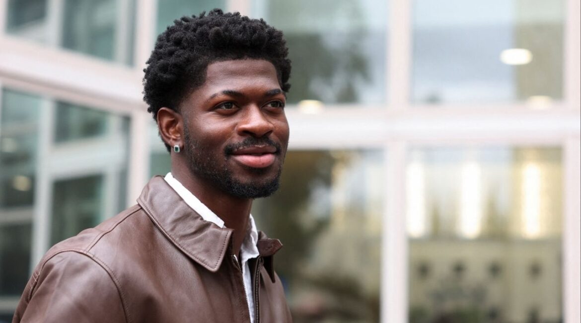 Grammy-winning musician Lil Nas X, whose legal name is Montero Hill, looks on outside a court, as he leaves following his preliminary hearing on four felony charges for allegedly assaulting and resisting police officers responding to an incident in August when police approached him while he was reportedly walking nearly naked on the streets of Los Angeles, in Van Nuys, California, U.S., November 17, 2025. (Reuters/Alison Dinner)