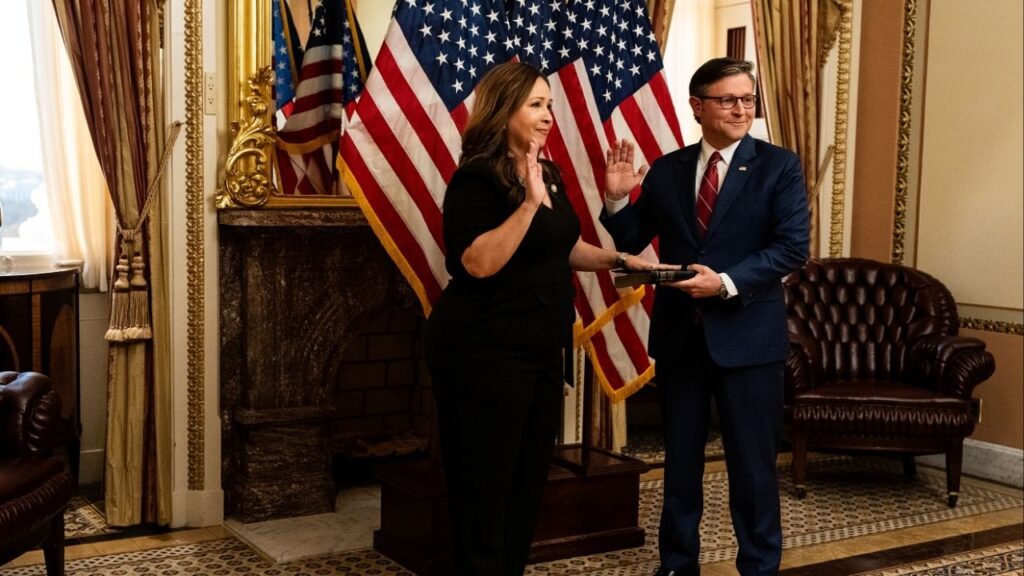 House Speaker Mike Johnson (R-La.) left, swears in Rep. Adelita Grijalva, (D-Ariz.), at the U.S. Capitol on Wednesday, Nov. 12, 2025. (Haiyun Jiang/The New York Times)