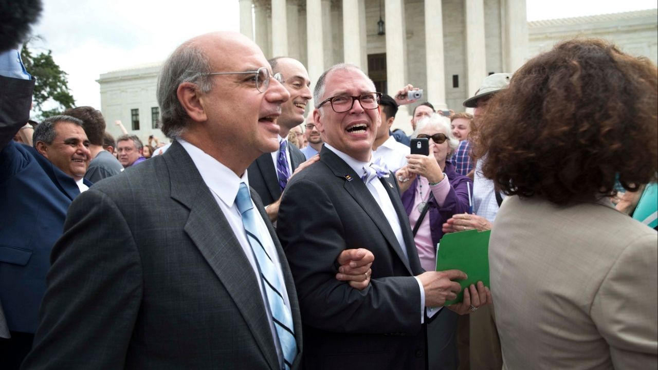 James Obergefell, center, the plaintiff in the same-sex marriage case Obergefell v. Hodges that resulted in a constitutional right to same-sex marriage, leaves the Supreme Court after the ruling in Washington, June 26, 2015. In November 2025, the court is considering whether to hear a case that would ask them to overturn Obergefell. (Doug Mills/The New York Times)