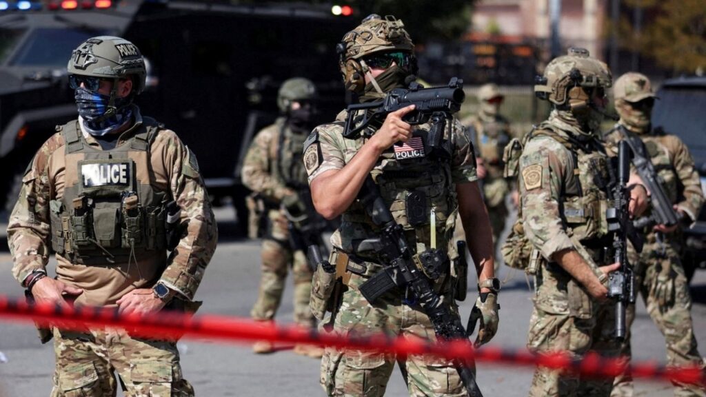 Law enforcement officers during a standoff with U.S. Immigration and Customs Enforcement (ICE) and federal officers in the Little Village neighborhood of Chicago, Illinois, U.S., October 4, 2025. (Reuters File)