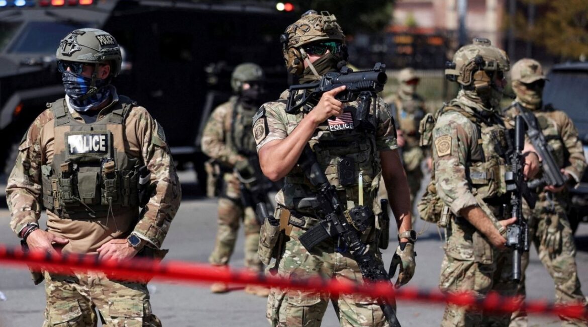 Law enforcement officers during a standoff with U.S. Immigration and Customs Enforcement (ICE) and federal officers in the Little Village neighborhood of Chicago, Illinois, U.S., October 4, 2025. (Reuters File)