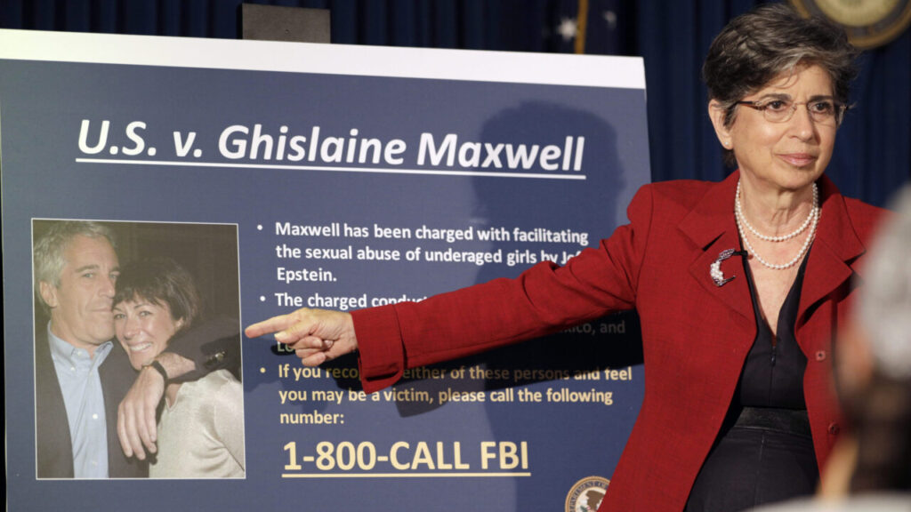 Image of Audrey Strauss, then the acting U.S. attorney for the Southern District of New York, announces the arrest of Ghislaine Maxwell in New York on July 2, 2020. Strauss is pointing at an FBI wanted poster of Maxwell, who is depicted alongside Jeffrey Epstein
