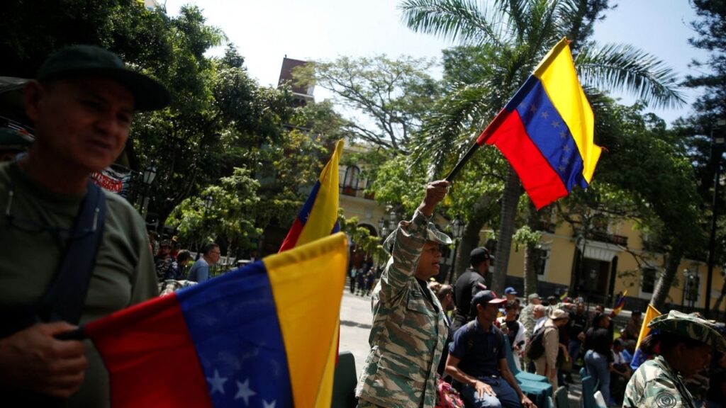 Members of the National Militia hold Venezuelan flags as they attend a military drill following Venezuelan President Nicolas Maduro's call to defend national sovereignty, amid rising tensions with the U.S., in Caracas, Venezuela October 4, 2025. (Reuters File)