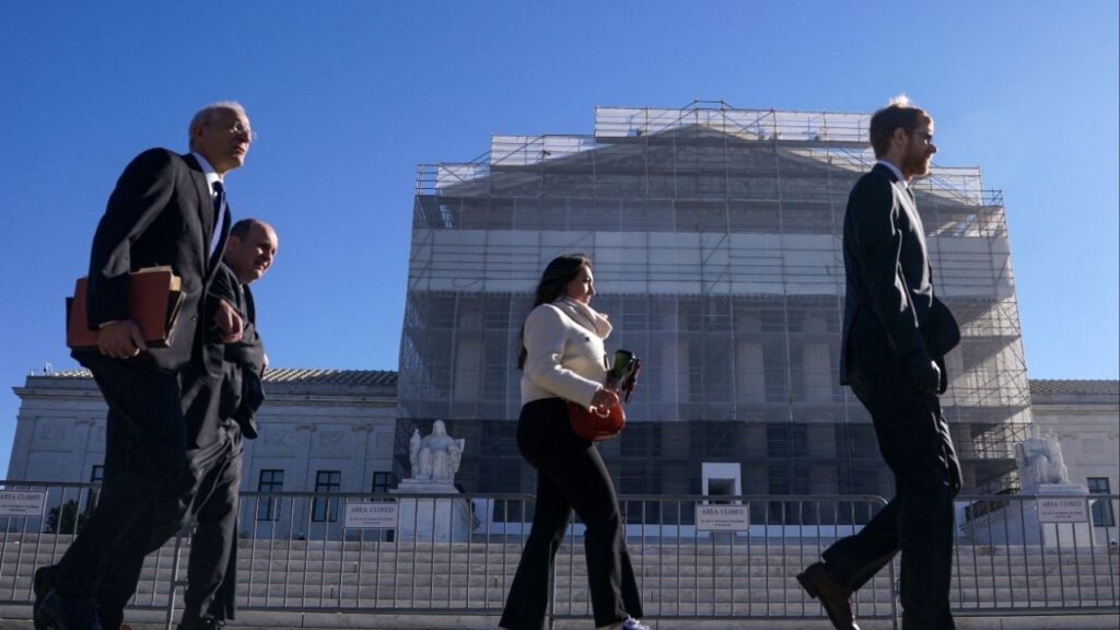 Members of the public walk outside the U.S. Supreme Court to attend oral arguments on U.S. President Donald Trump's bid to preserve sweeping tariffs after lower courts ruled that Trump overstepped his authority, in Washington, D.C., U.S., November 5, 2025. (Reuters/Nathan Howard)