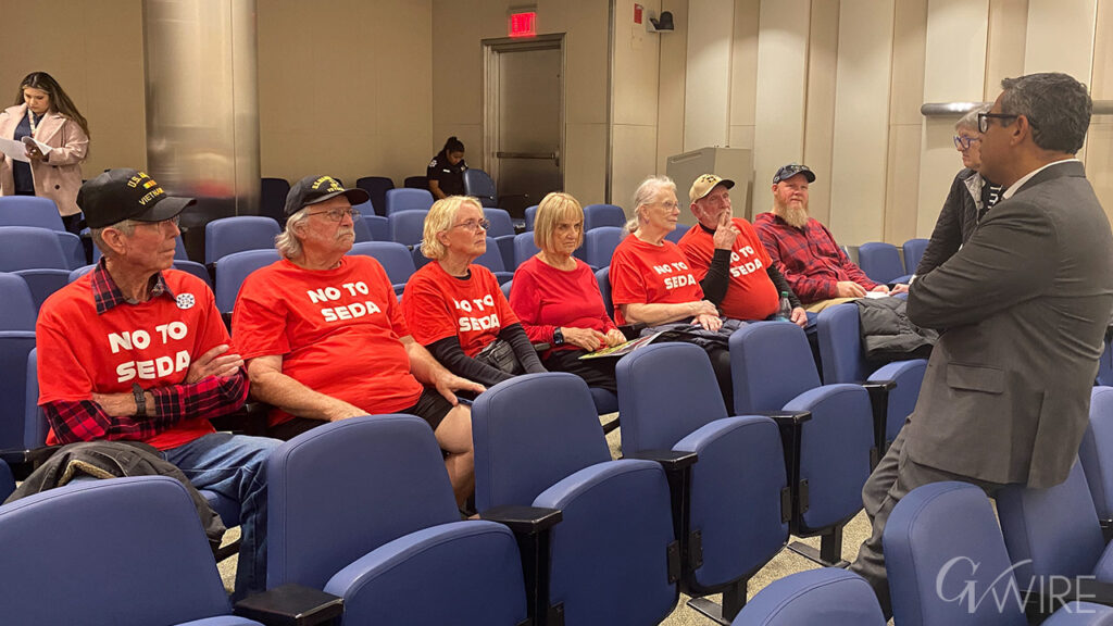 Fresno City Councilmember Miguel Arias talks to opponents of SEDA at the Nov. 6, 2025 Fresno City Council meeting