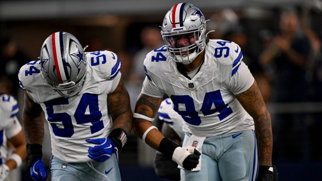 Nov 3, 2025; Arlington, Texas, USA; Dallas Cowboys defensive end Marshawn Kneeland (94) and defensive end Sam Williams (54) celebrates after returning a blocked punt for a touchdown during the game between the Dallas Cowboys and the Arizona Cardinals at AT&T Stadium. (Jerome Miron-Imagn Images)