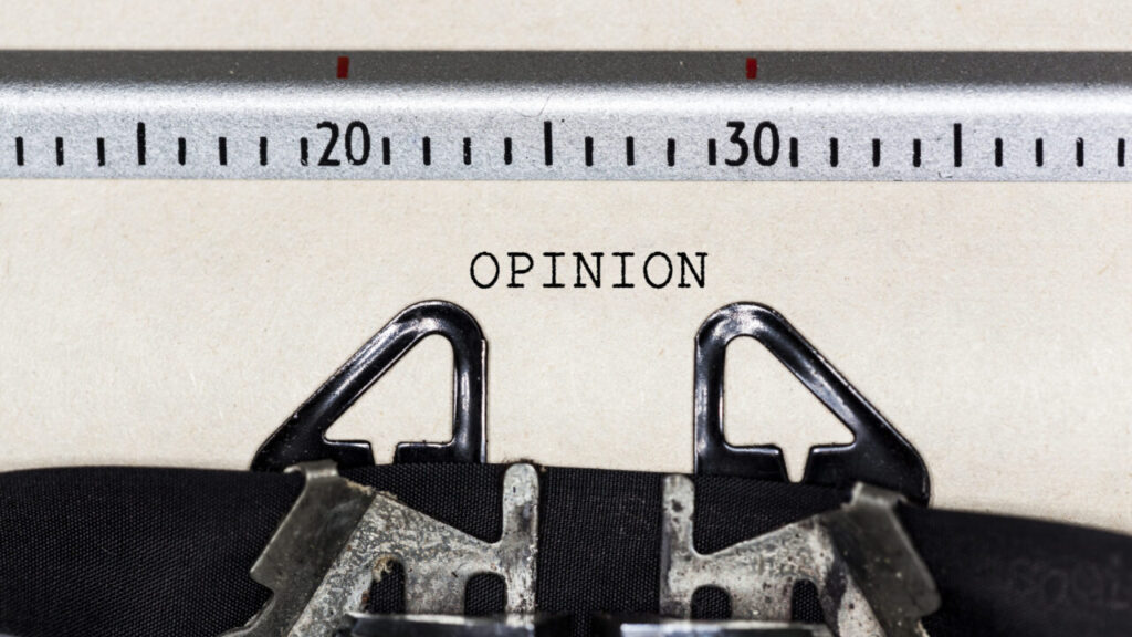 Image of the word "opinion" on a sheet of paper in a typewriter