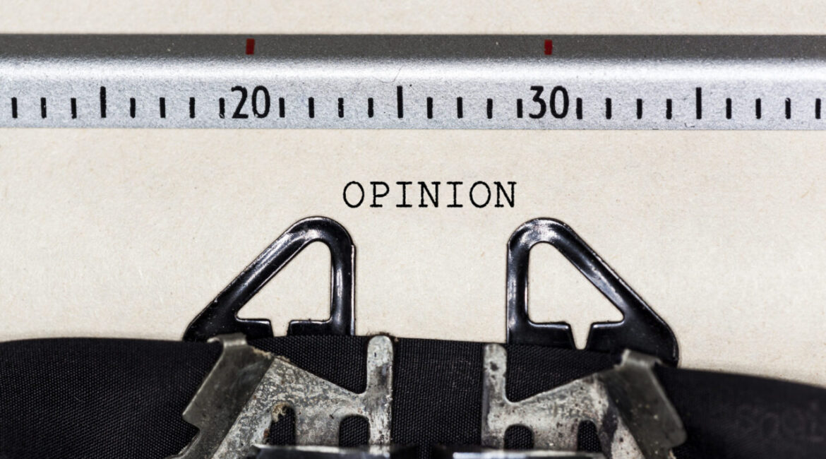 Image of the word "opinion" on a sheet of paper in a typewriter