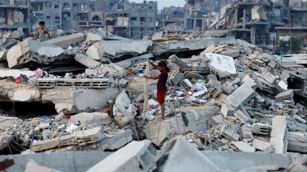 Palestinian children stand on the rubble of destroyed buildings, amid a ceasefire between Israel and Hamas, in Jabalia, northern Gaza Strip, November 6, 2025. (Reuters/Mahmoud Issa)
