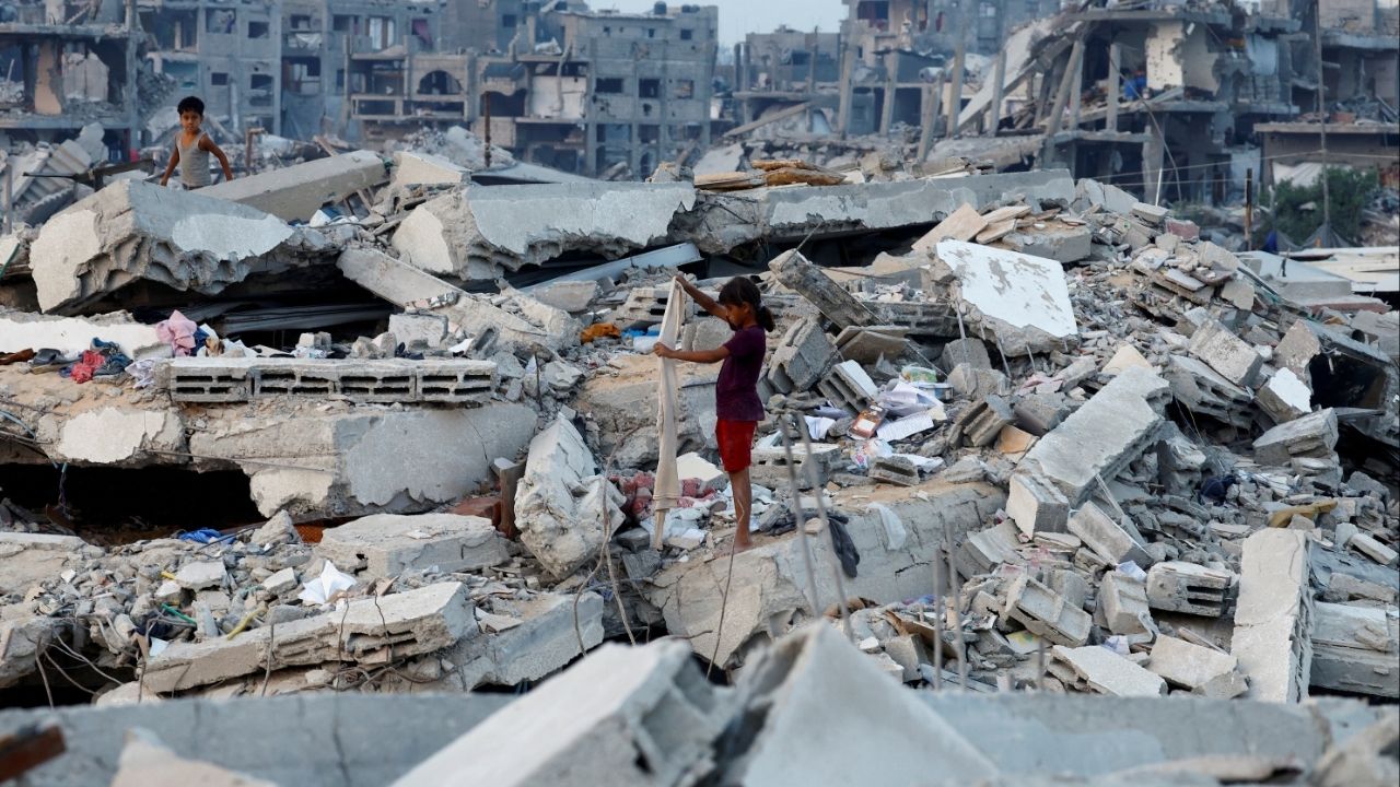 Palestinian children stand on the rubble of destroyed buildings, amid a ceasefire between Israel and Hamas, in Jabalia, northern Gaza Strip, November 6, 2025. (Reuters/Mahmoud Issa)