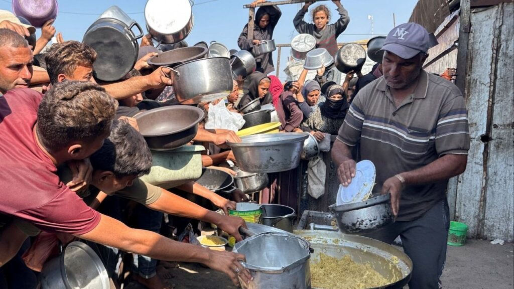 Palestinians gather to receive food from a charity kitchen amid a ceasefire between Israel and Hamas, in Khan Younis in the southern Gaza Strip, November 5, 2025. (Reuters/Haseeb Alwazeer)