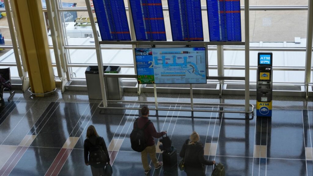 Passengers at Reagan National Airport in Washington on Nov. 7, 2025, the first day of reduced operations at 40 airports around the country. The leaders of the Department of Transportation and the Federal Aviation Administration announced on Sunday, Nov. 16, they were ending flight restrictions at 40 airports that were imposed just over a week ago during the government shutdown, citing improved staffing levels among air traffic controllers. (Andrew Leyden/The New York Times)