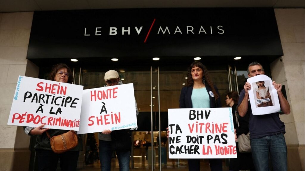 People protest against the sale of child-like sex dolls by Chinese fast-fashion retailer Shein during a demonstration in front of the Bazar de l'Hotel de Ville, Le BHV Marais department store, ahead of the opening of Shein's fast fashion first permanent shop in Paris, France, November 3, 2025. The slogans on placards read "Shame on Shein!", "Shein is complicit in child pornography" and "BHV, your shop window shouldn't hide this shame". (Reuters/Abdul Saboor)