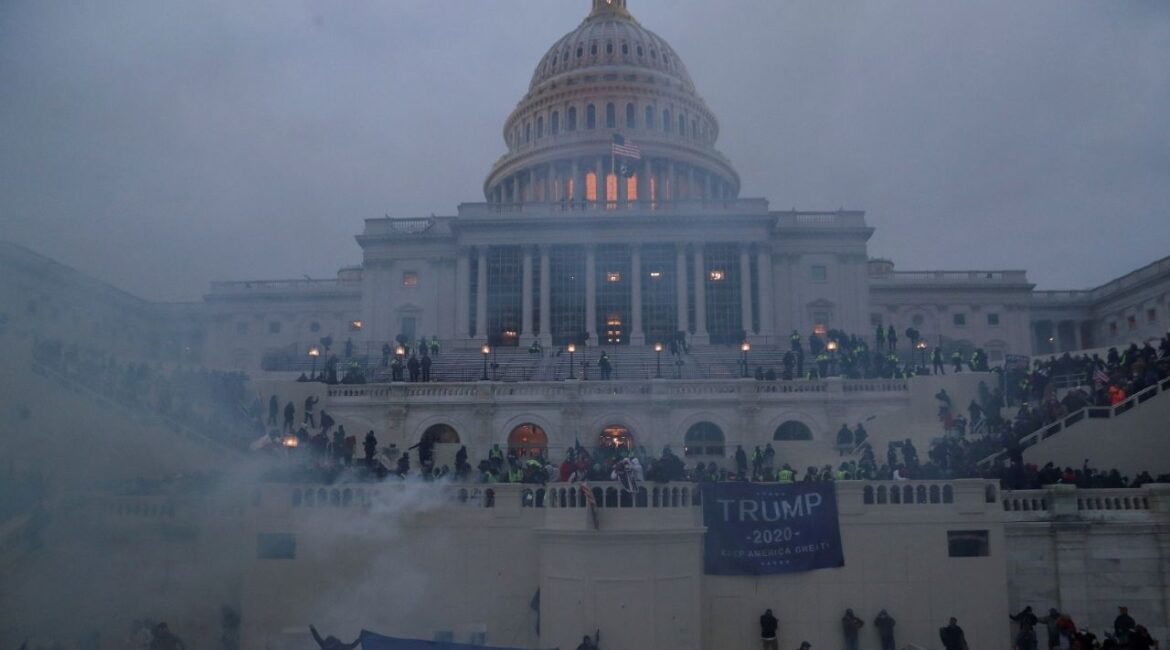 Police officers stand guard as supporters of U.S. President Donald Trump gather in front of the U.S. Capitol Building in Washington, U.S., January 6, 2021. (Reuters/Leah Millis)