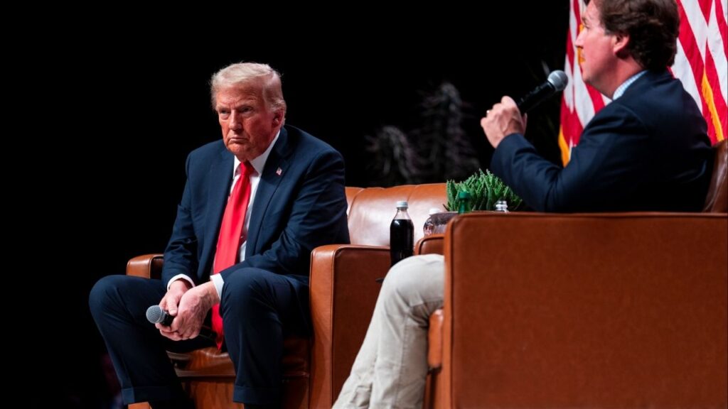 President Donald Trump takes part in a talk with Tucker Carlson during his re-election campaign in Glendale, Ariz., Oct. 31, 2024. President Trump defended Tucker Carlson on Sunday, Nov. 17, 2025, for his sympathetic interview with the white nationalist and avowedly racist antisemite Nick Fuentes, breaking a conspicuous weekslong silence on an episode that had ignited bitter infighting among conservatives. (Doug Mills/The New York Times)