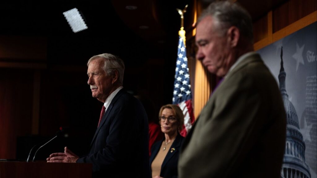 Sen. Angus King (I-Maine) is joined by Sen. Maggie Hassan (D-N.H.) and Sen. Tim Kaine (D-Va.) as he speaks to reporters on Capitol Hill on Sunday night, Nov. 9, 2025. They are among the eight senators in the Democratic caucus who broke with the party late Sunday to vote with Republicans and advance legislation to end the government shutdown. (Tierney L. Cross/The New York Times)