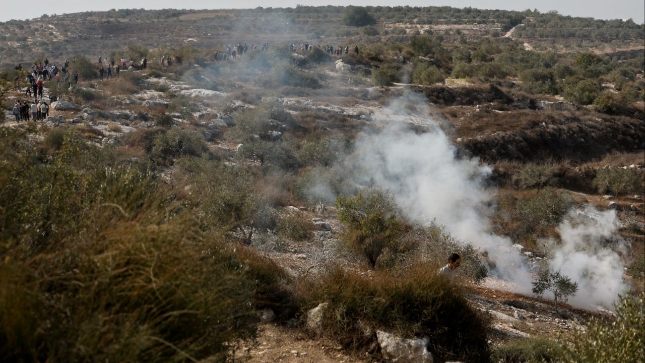 Smoke rises at the scene of a clash between Israeli soldiers and Palestinian protesters who went out to pray on their land, threatened by Israeli settlement expansion, in Beit Lid, near Tulkarm, in the Israeli-occupied West Bank, November 7, 2025. (Reuters/Raneen Sawafta)