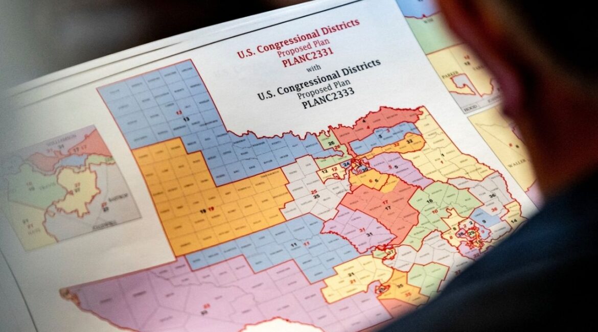 State Representative Matt Morgan (R-TX) holds a map of the new proposed congressional districts in Texas, during a legislative session as Democratic lawmakers, who left the state to deny Republicans the opportunity to redraw the state's 38 congressional districts, begin returning to the Texas State Capitol in Austin, Texas, U.S. August 20, 2025. (Reuters/Sergio Flores)