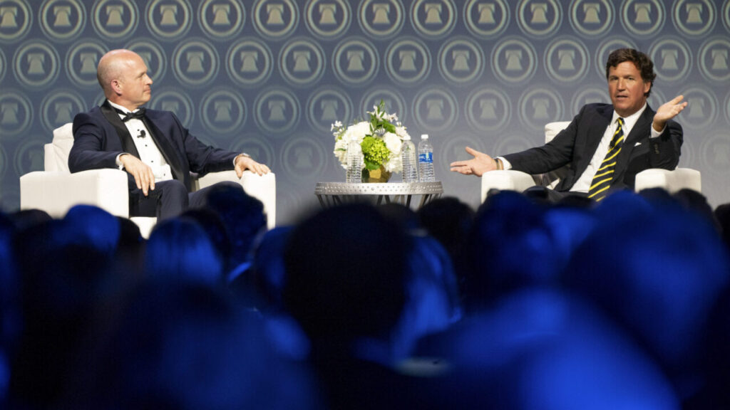 Image of Heritage Foundation President Kevin Roberts talking to right-wing podcaster Tucker Carlson