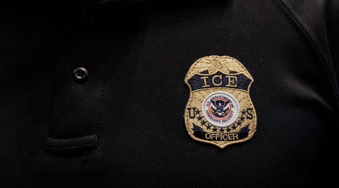 The badge of U.S. Immigration and Customs Enforcement (ICE) is embroidered on a polo shirt of an ICE employee in Arlington, Texas, U.S. August 26, 2025. (Reuters/Shelby Tauber)